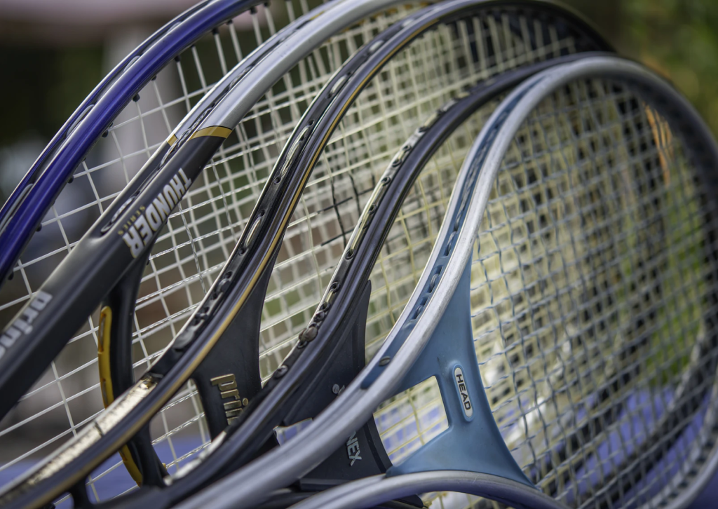 (alt-text: Storing sports equipment, like these tennis rackets, keeps sports gear in good condition while not in use.)