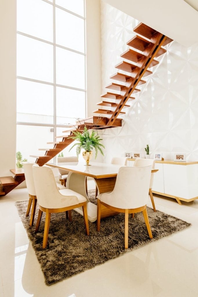 <alt text: A room with a consistent theme that flows through all its elements like stairs, furniture and other furnishings.>