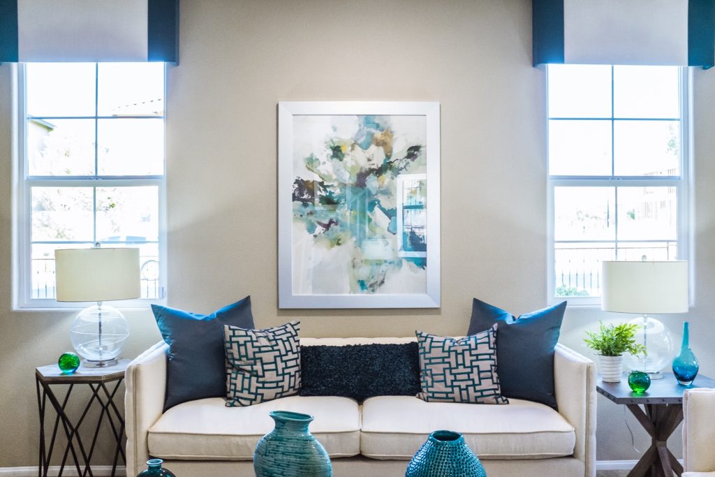 (alt-text: Adding artwork to your walls will make your house feel more like home.) 